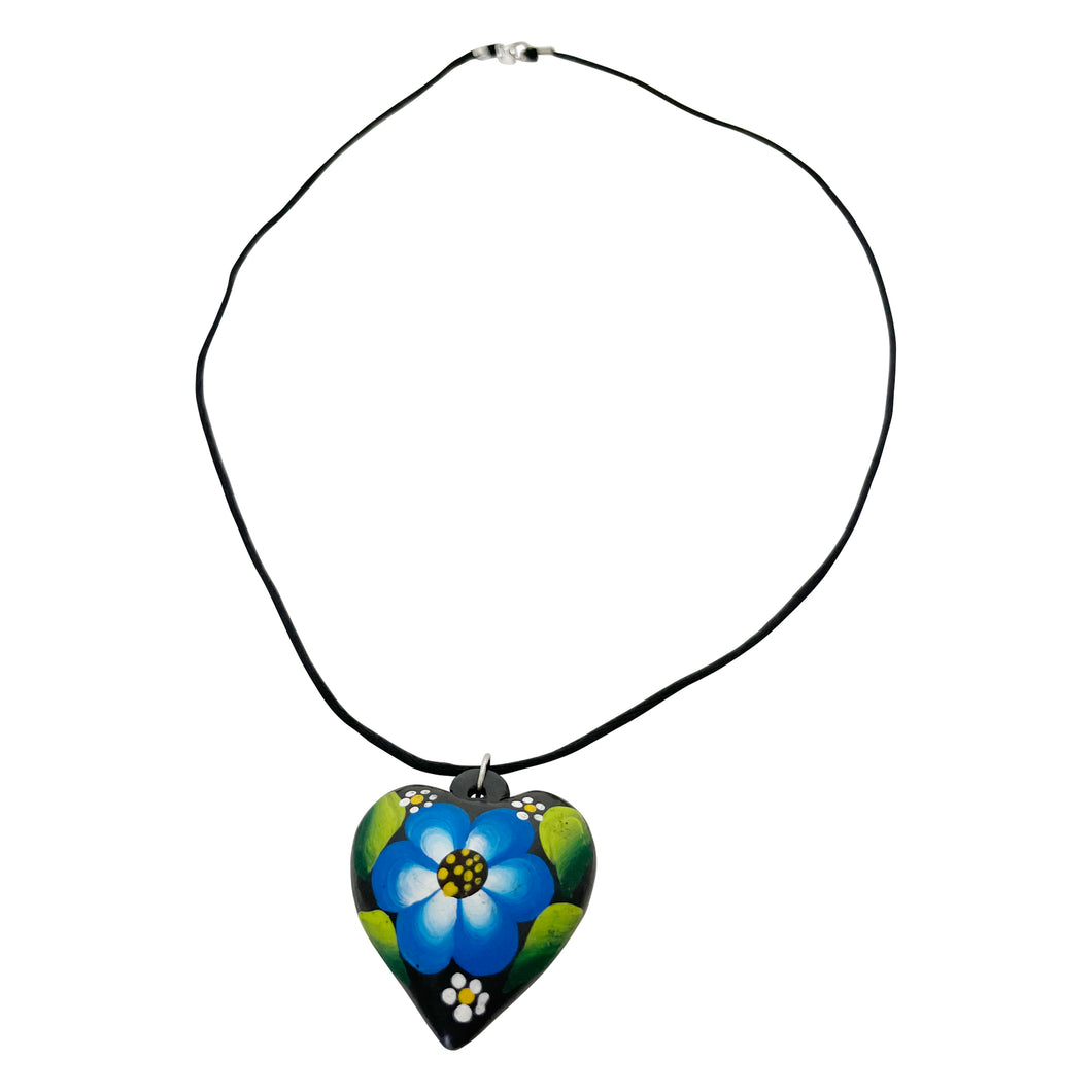 Oaxacan Black Clay hand-sculpted heart-shaped necklace with painted floral details in blue